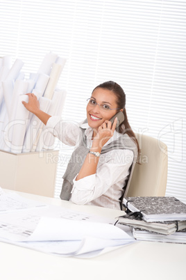 Young female architect with phone