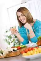 Cooking - Smiling woman with glass of white wine