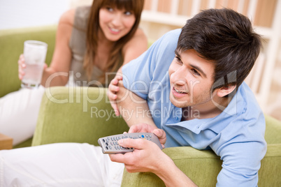 Student - happy teenager holding remote control