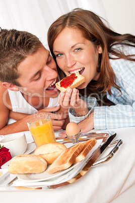 Young happy couple having luxury breakfast