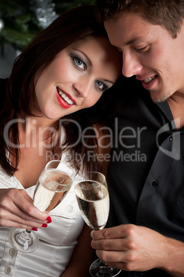 Portrait of extravagant man and woman with champagne