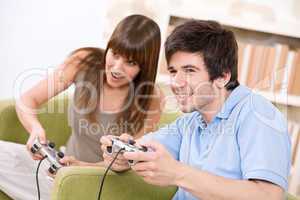 Student - happy teenagers playing video game