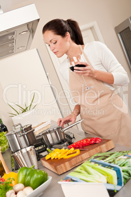 Young woman cooking in the kitchen