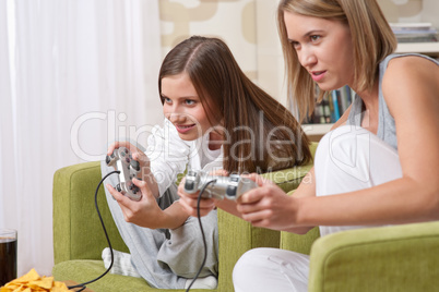 Students - Two female teenager playing video TV game