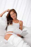 White lounge - Young woman holding white book