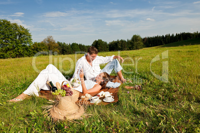 Picnic - Romantic couple in spring nature