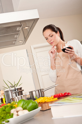 Young woman cooking in the kitchen