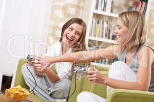 Students - Two happy female teenager playing TV game