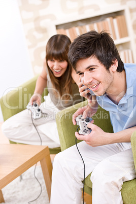 Student - happy teenagers playing video game
