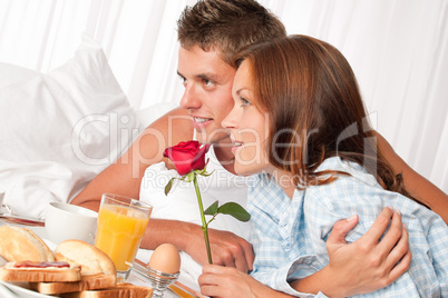 Young couple having luxury hotel breakfast