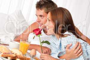 Young couple having luxury hotel breakfast