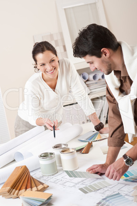Two interior designer working at office with color swatch