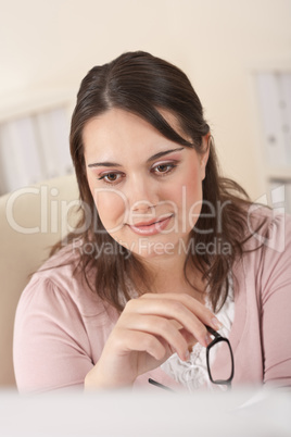 Young businesswoman watching computer screen