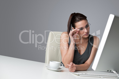 Thoughtful business woman at office with coffee