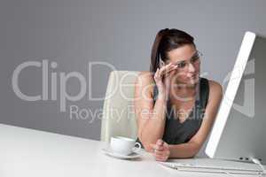 Thoughtful business woman at office with coffee