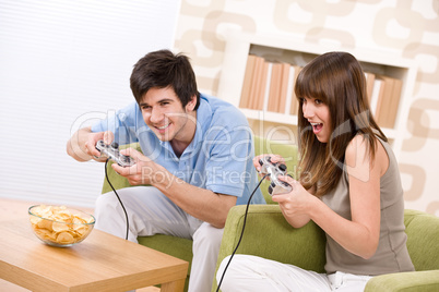 Student - happy teenagers playing video game having fun
