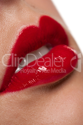 Close-up of gloosy red woman lips