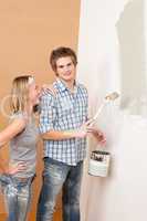 Home improvement: Man painting wall with paintbrush