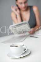 Successful businesswoman read newspaper at office