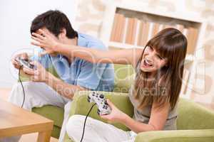 Student - happy teenagers playing video game