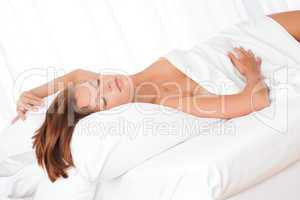 White lounge - Brown hair woman sleeping on white bed