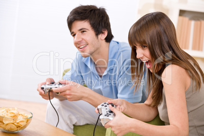 Student - happy teenagers playing video game