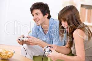 Student - happy teenagers playing video game