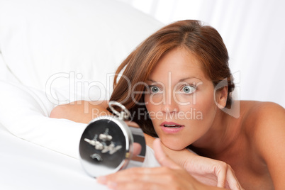 White lounge - Woman watching alarm clock