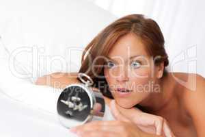 White lounge - Woman watching alarm clock