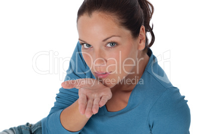 Brown hair woman blowing a kiss