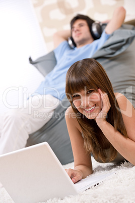 Student - Happy teenager with laptop relaxing