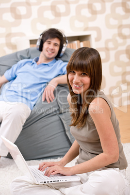 Student - Happy teenager with laptop and headphones