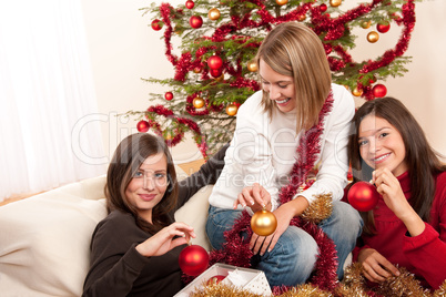 Three cheerful women having fun on Christmas