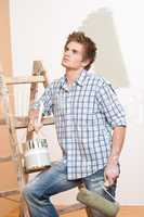 Home improvement: Young man with paint roller