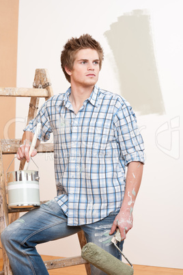 Home improvement: Young man with paint roller