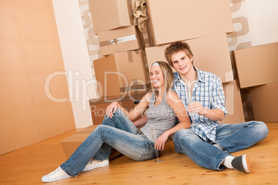 Moving house: Happy man and woman celebrating