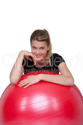 Fitness - Young woman with exercise ball on white