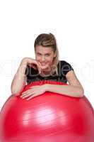 Fitness - Young woman with exercise ball on white