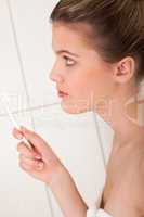 Body care series - Blond woman with white toothbrush
