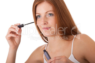 Body care series - Beautiful red hair woman applying mascara