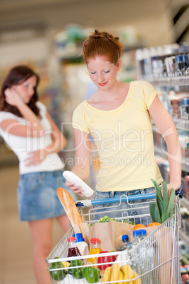 Shopping series - Red hair woman holding bottle of shampoo