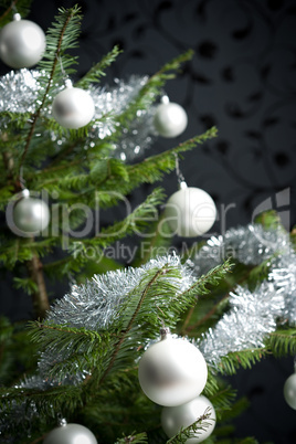 Silver decorated Christmas tree with balls and chains