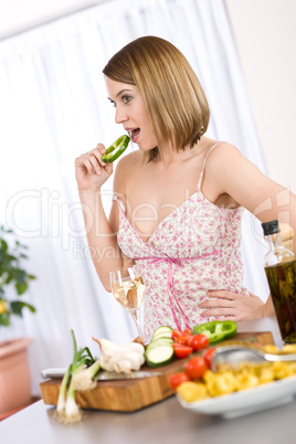 Cooking - smiling woman with glass of white wine