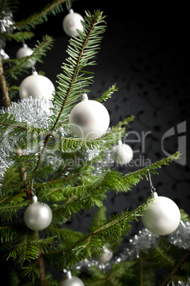 Silver decorated Christmas tree with balls and chains