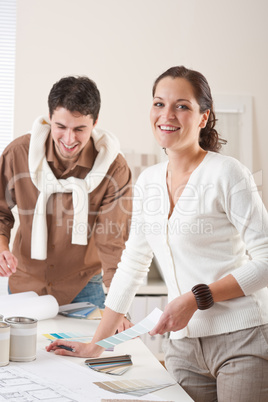 Two interior designer working at office with color swatch