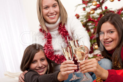 Three cheerful women having fun on Christmas