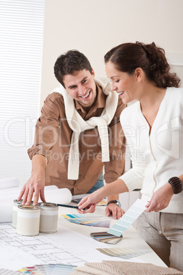 Two interior designer working at office with color swatch