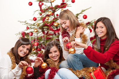 Four young women having fun on Christmas