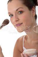 Body care series - Young beautiful woman with make-up brush