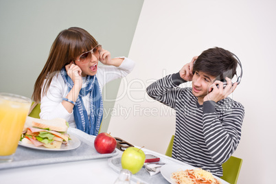 Student cafeteria - teenage couple having fun